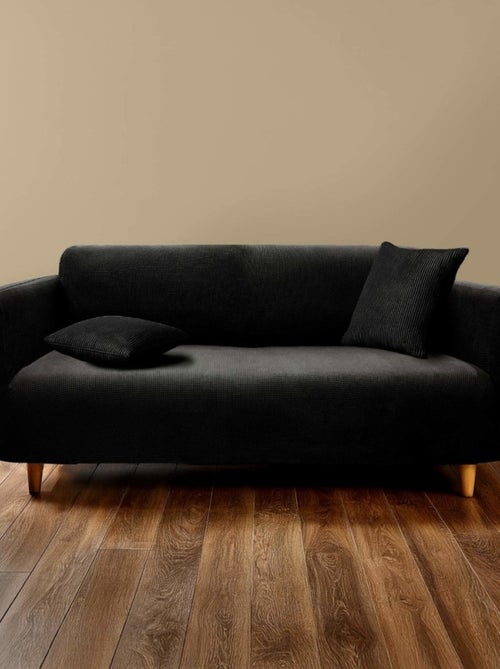Housse de canapé extensible en polyester gaufré coloris noir - Kiabi Housse de canapé extensible en polyester gaufré coloris noir - Kiabi