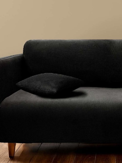 Housse de canapé extensible en polyester gaufré coloris noir - Kiabi Housse de canapé extensible en polyester gaufré coloris noir - Kiabi