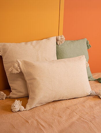 Housse de coussin en laine à pompons