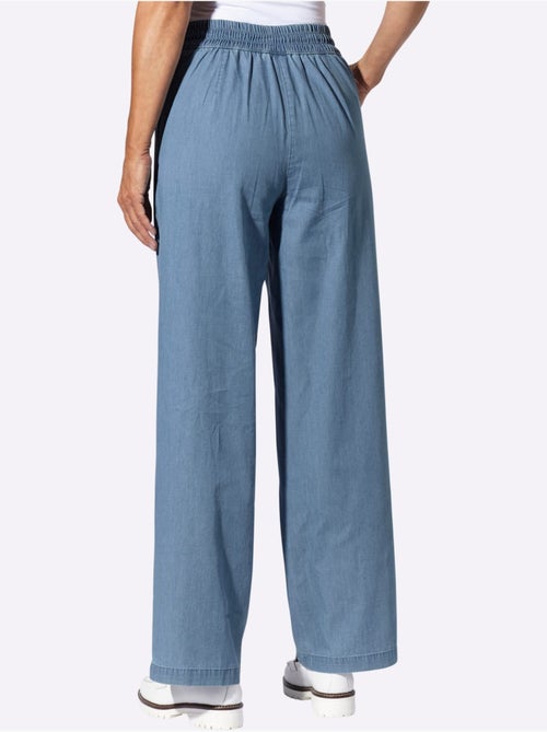 Jean à la coupe haute avec jambes larges et ceinture élastique - Taille standard - Moda Vilona - Kiabi Jean à la coupe haute avec jambes larges et ceinture élastique - Taille standard - Moda Vilona - Kiabi