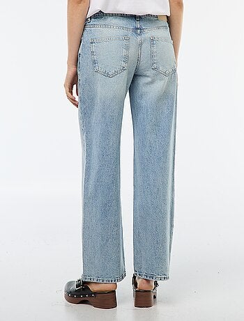 Jean coupe large et taille haute avec ceinture asymétrique