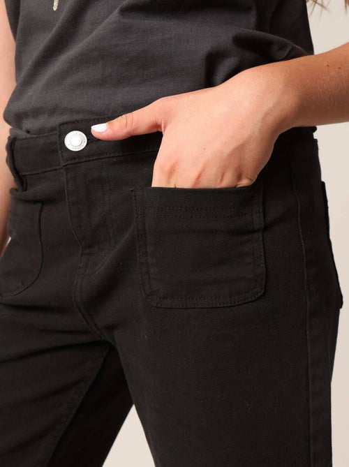 Jean flare fille à poches plaquées. 'Deeluxe' - Kiabi