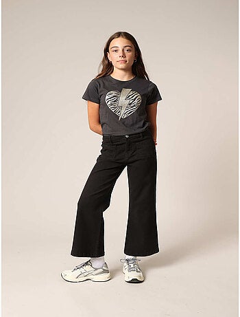 Jean flare fille à poches plaquées. 'Deeluxe'