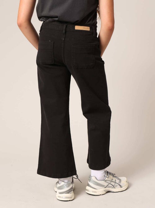 Jean flare fille à poches plaquées. 'Deeluxe' - Kiabi