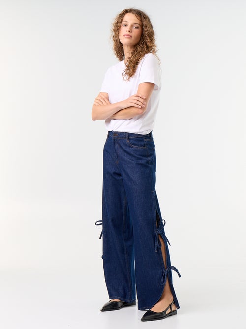 Jean large wide leg avec nœuds fantaisies à la base - Kiabi Jean large wide leg avec nœuds fantaisies à la base - Kiabi