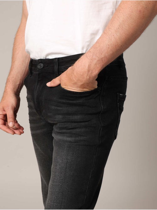 Jean slim effet délavé moderne et confortable
 'Deeluxe' - Kiabi