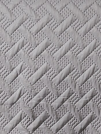 Jeté de lit aux formes géométriques surpiquées