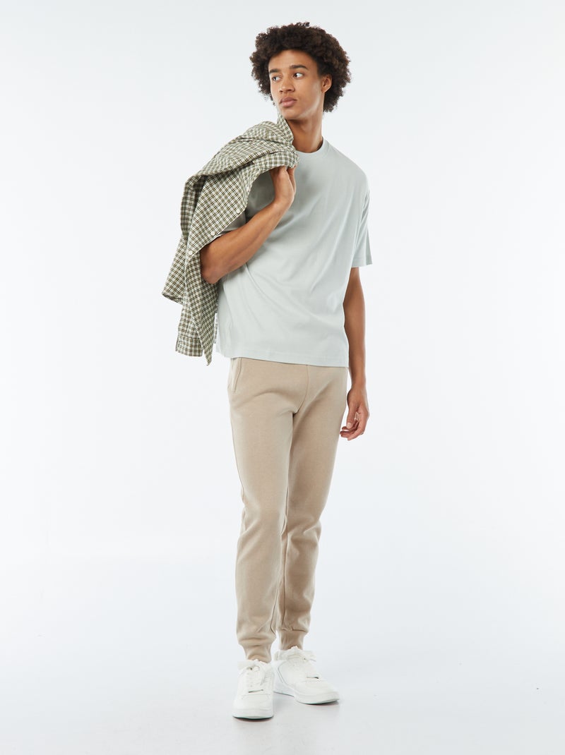 Jogging en molleton gratté avec 2 poches zippées beige - Kiabi