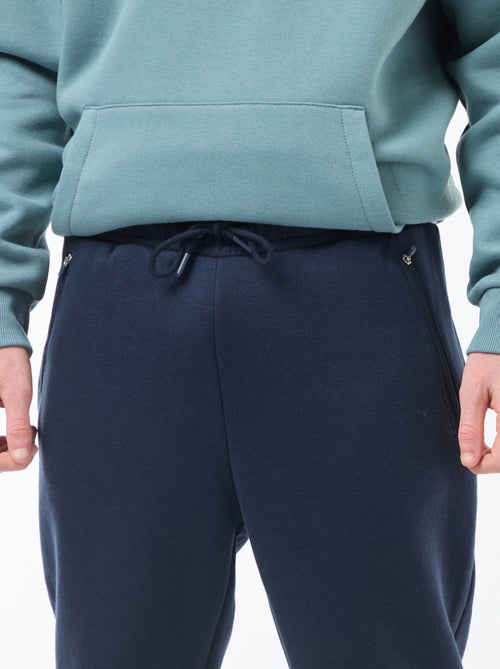 Jogging en molleton gratté avec 2 poches zippées - Kiabi