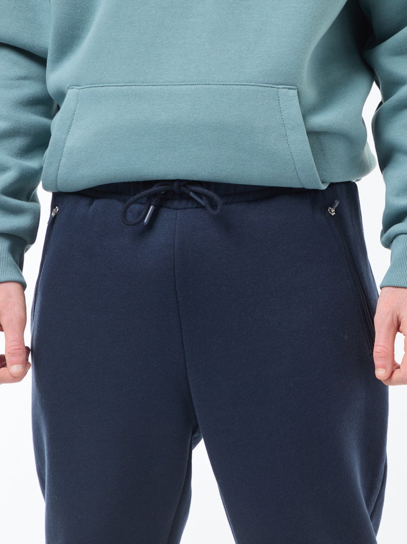 Jogging en molleton gratté avec 2 poches zippées Bleu marine - Kiabi