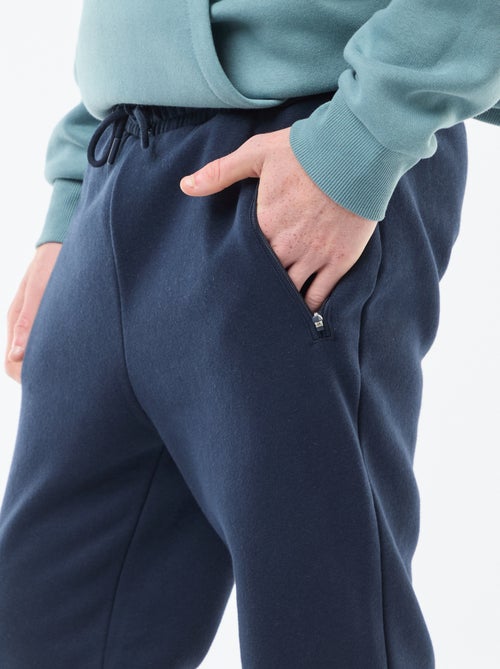 Jogging en molleton gratté avec 2 poches zippées - Kiabi