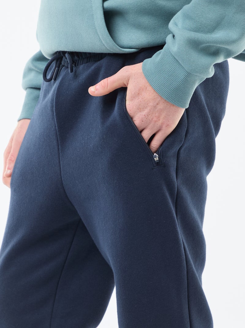 Jogging en molleton gratté avec 2 poches zippées Bleu marine - Kiabi