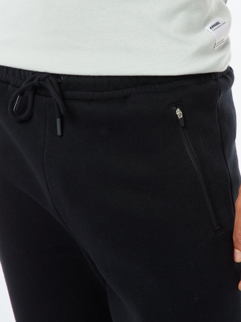 Jogging en molleton gratté avec 2 poches zippées Noir - Kiabi