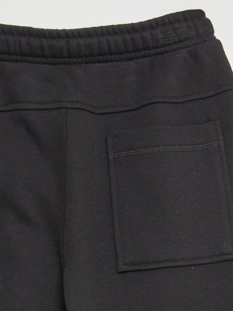 Jogging large avec bandes contrastantes Noir - Kiabi