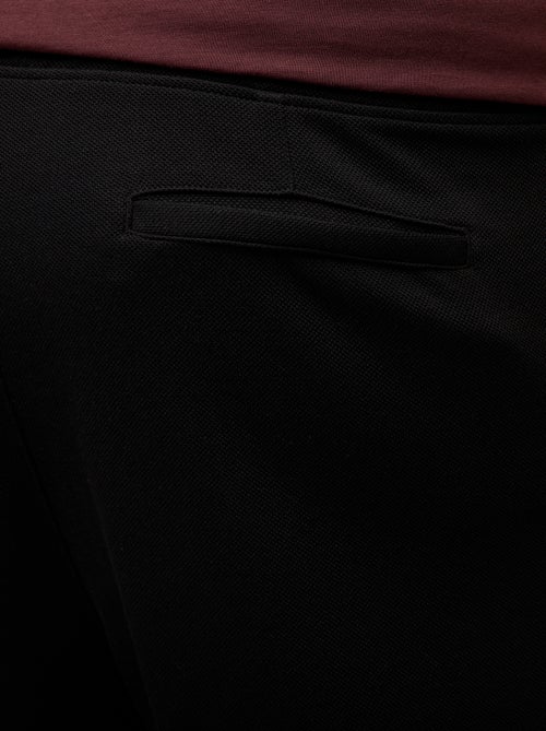 Jogging uni en maille piquée - Kiabi