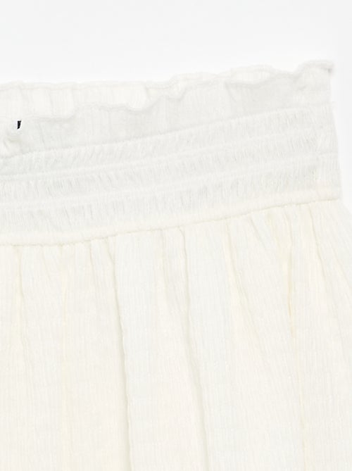 Jupe courte forme patineuse avec short intégré - Kiabi