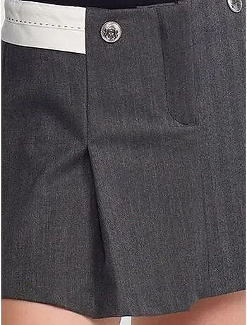 Jupe courte plissée à taille haute avec ceinture dilvin
