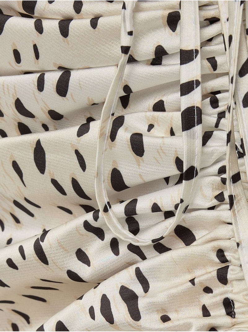 Jupe midi moulante en satin imprimé avec fente Multicolore - Kiabi
