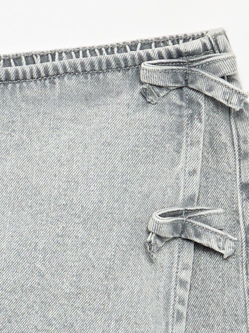 Jupe short courte en jean avec nœuds - Kiabi Jupe short courte en jean avec nœuds - Kiabi