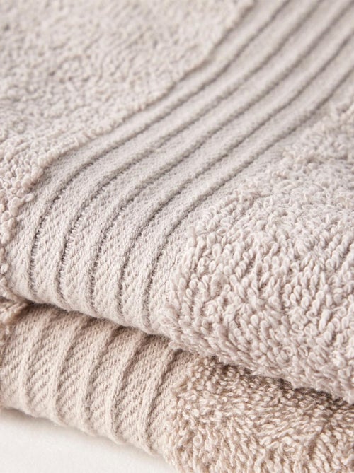 Lot de 2 serviettes de toilette coton uni ESSENTIAL - Kiabi Lot de 2 serviettes de toilette coton uni ESSENTIAL - Kiabi