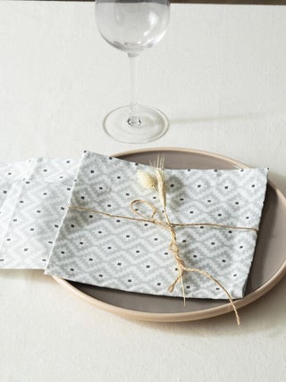 Lot de 4 serviettes de table aux motifs géométriques
