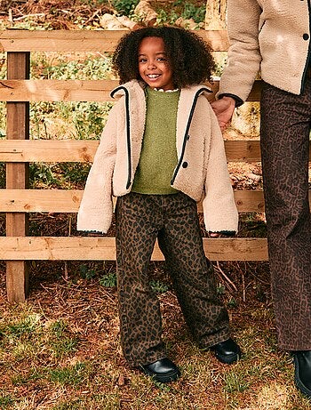 Manteau fausse fourrure avec ouverture pressionnée