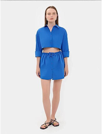 Mini-jupe boutonnée taille haute avec cordon de serrage