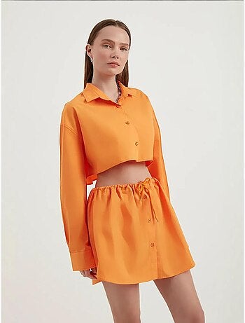 Mini-jupe boutonnée taille haute avec cordon de serrage