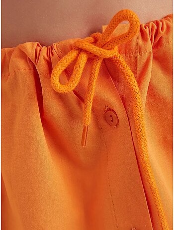 Mini-jupe boutonnée taille haute avec cordon de serrage