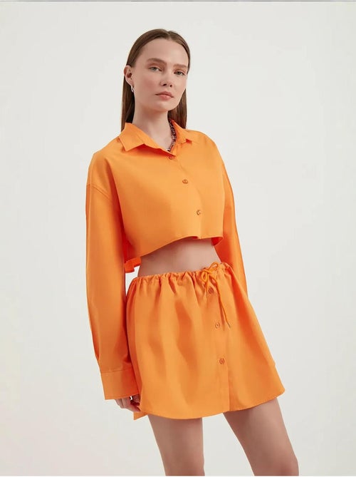 Mini-jupe boutonnée taille haute avec cordon de serrage - Kiabi
