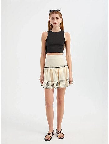 Mini-jupe brodée à volants taille haute