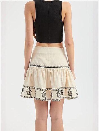 Mini-jupe brodée à volants taille haute