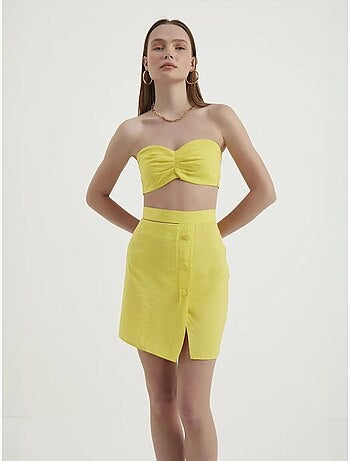 Mini-jupe taille haute avec boutons latéraux