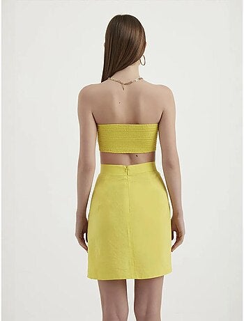 Mini-jupe taille haute avec boutons latéraux