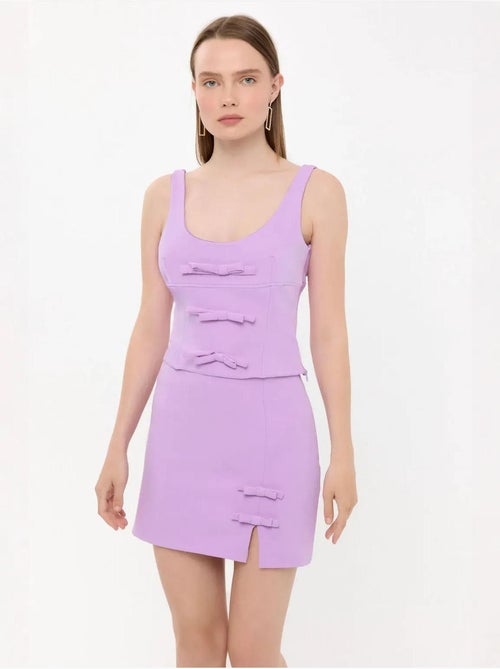 Mini-jupe tissée taille haute avec détail nœud - Kiabi Mini-jupe tissée taille haute avec détail nœud - Kiabi