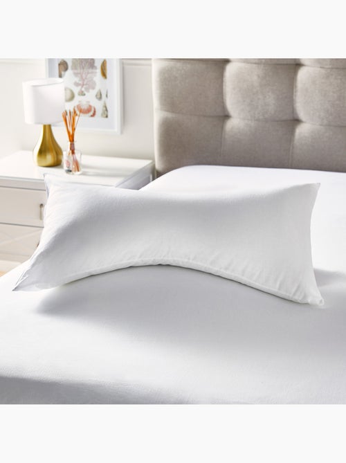 Oreiller cervical en fibre Fermeté moyenne Housse en coton - Kiabi Oreiller cervical en fibre Fermeté moyenne Housse en coton - Kiabi