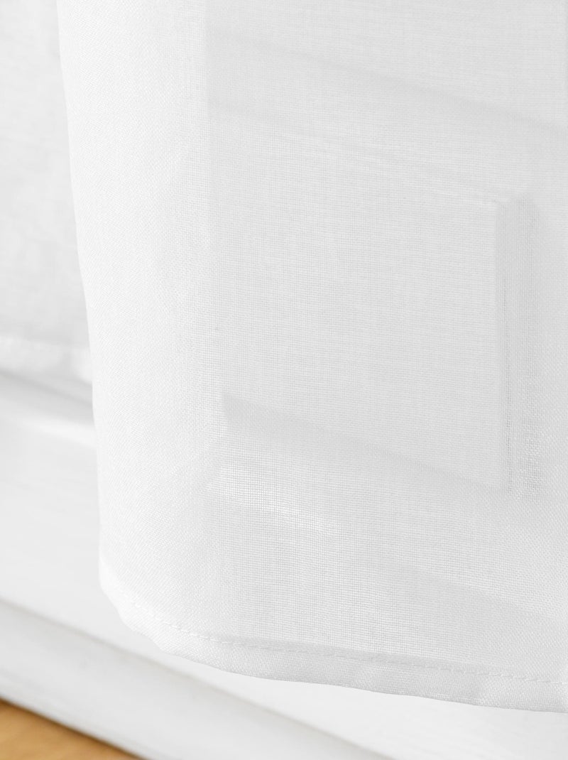 Paire de voilages passe-tringle en voile sablé avec finitions pompons Blanc - Kiabi