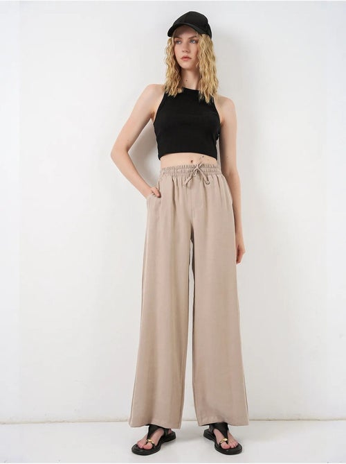 Pantalon à jambe large taille haute avec poche bdart - Kiabi Pantalon à jambe large taille haute avec poche bdart - Kiabi