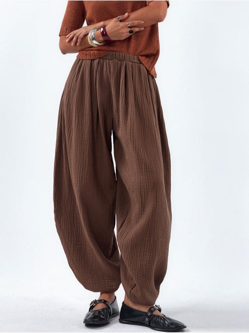 Pantalon à jambes larges avec taille élastique busem - Kiabi Pantalon à jambes larges avec taille élastique busem - Kiabi