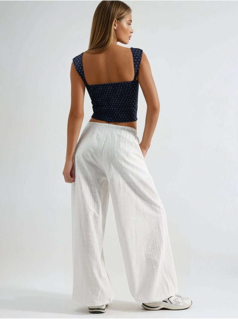 Pantalon à jambes larges et taille élastiquée avec cordon de serrage busem Blanc - Kiabi