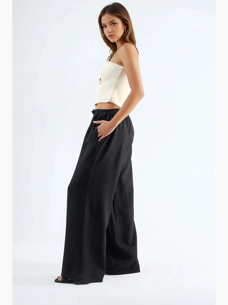 Pantalon à jambes larges et taille élastiquée avec cordon de serrage et poches busem Noir - Kiabi