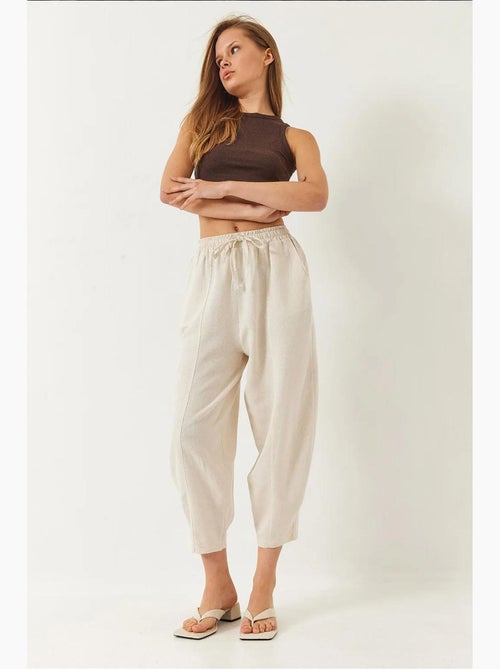 Pantalon à taille élastique et entrejambe bas avec poches lucci - Kiabi Pantalon à taille élastique et entrejambe bas avec poches lucci - Kiabi