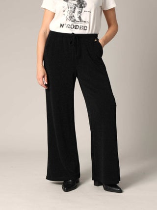 Pantalon ample et fluide en maille brillante 'Deeluxe'