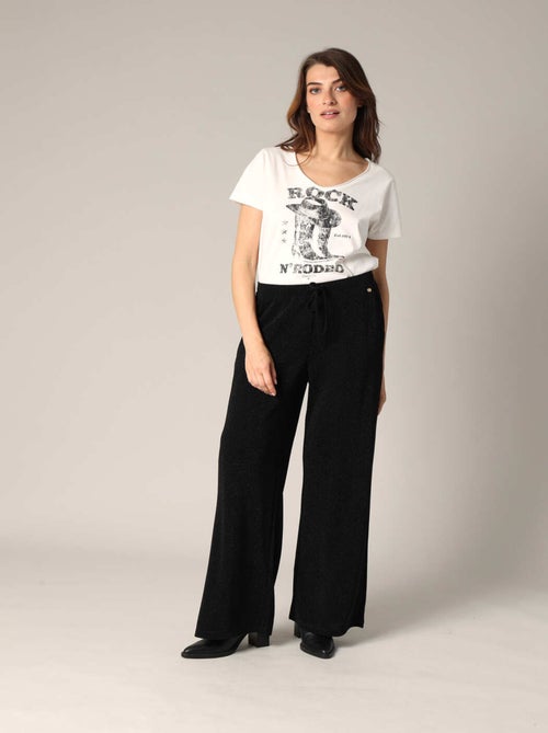 Pantalon ample et fluide en maille brillante 'Deeluxe' - Kiabi Pantalon ample et fluide en maille brillante 'Deeluxe' - Kiabi