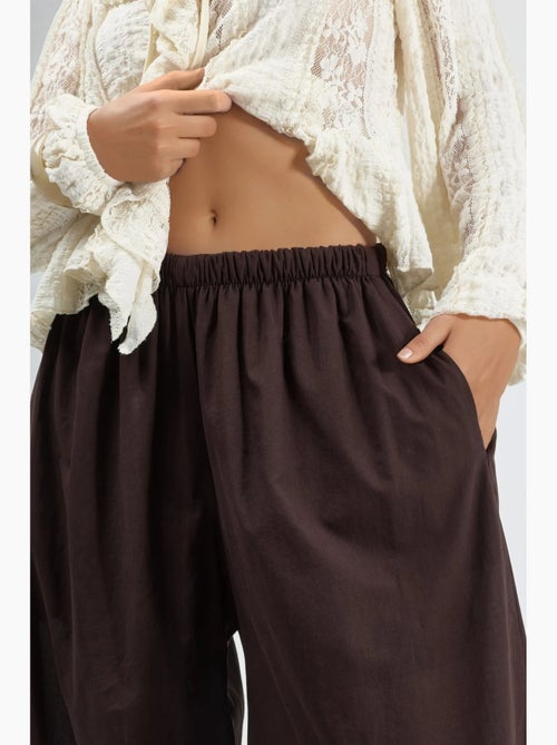 Pantalon crêpe à jambes larges busem - Kiabi Pantalon crêpe à jambes larges busem - Kiabi