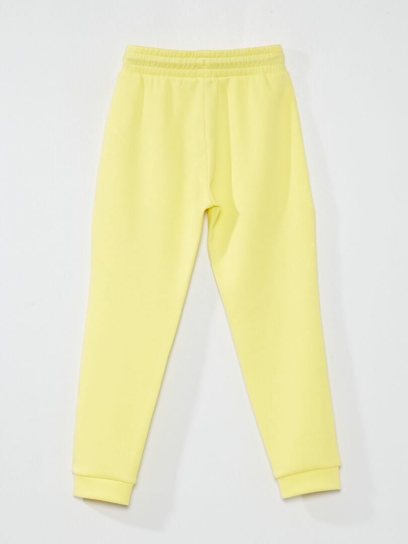 pantalon asics jaune