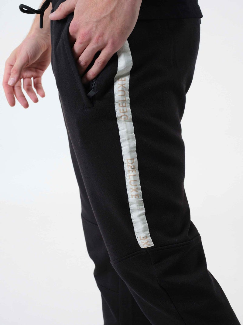 Pantalon de jogging à bandes sérigraphiées 'Deeluxe' Noir Ecru - Kiabi