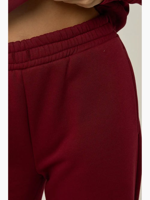 Pantalon de jogging à jambes larges avec cordon de serrage à la taille hiccup - Kiabi Pantalon de jogging à jambes larges avec cordon de serrage à la taille hiccup - Kiabi