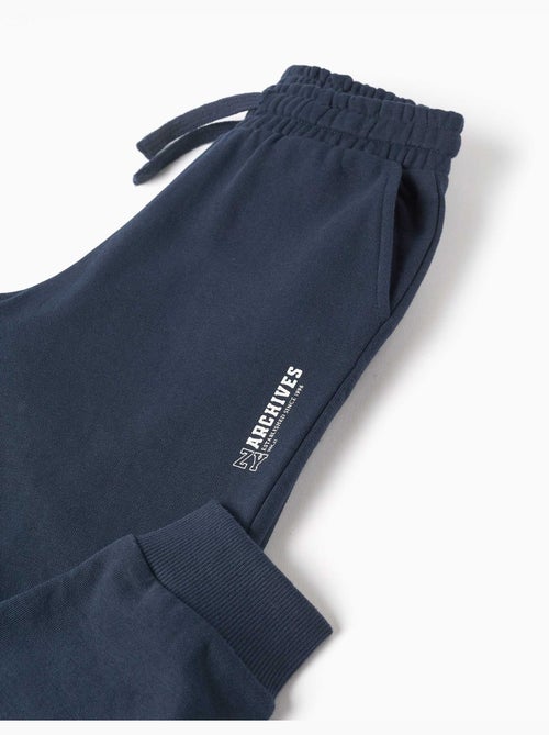 Pantalon de jogging ajusté en molleton avec poches et imprimé zy - Kiabi Pantalon de jogging ajusté en molleton avec poches et imprimé zy - Kiabi