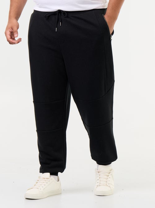 Pantalon de jogging avec bas resserré et poches zippées - Kiabi Pantalon de jogging avec bas resserré et poches zippées - Kiabi